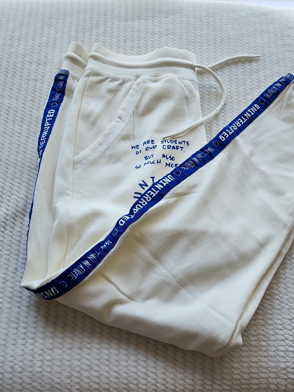 More Than An Athlete Cream Sweatpants with Blue Text Design Brand New